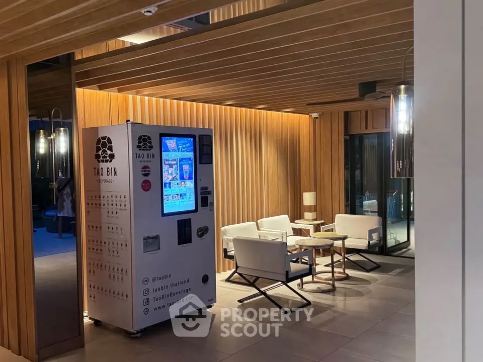 Modern lobby with vending machine and stylish seating area