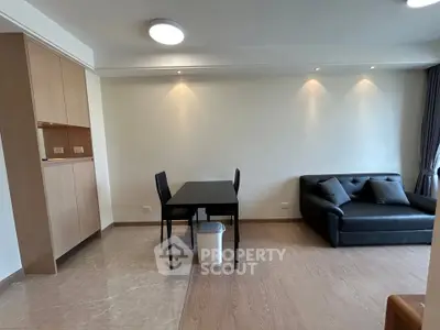 Modern living room with sleek furniture and open layout, perfect for urban living.