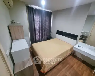 Cozy bedroom with modern furnishings and wooden flooring