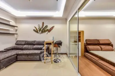 Modern living room with stylish decor and cozy seating area in a contemporary apartment.