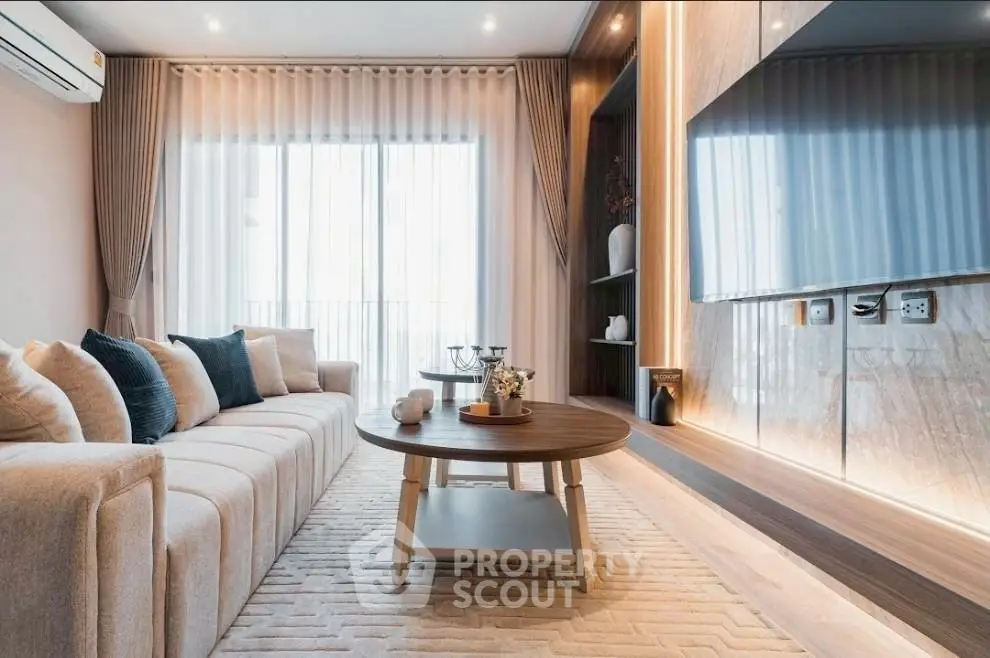 Luxurious living room with modern decor and large TV