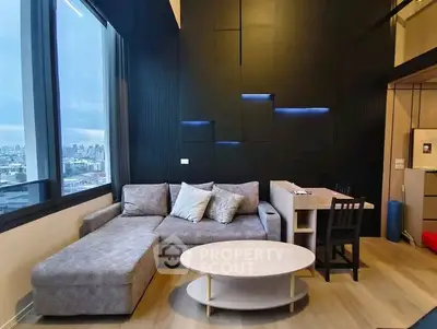 Modern living room with city view, stylish furniture, and sleek design.
