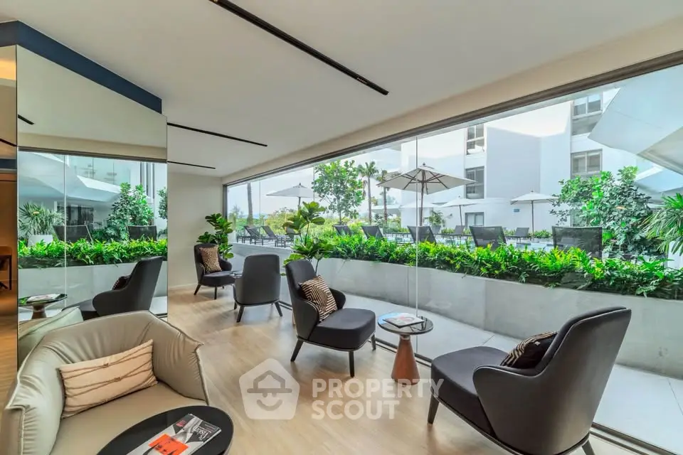Luxurious modern lounge with panoramic garden view and stylish seating