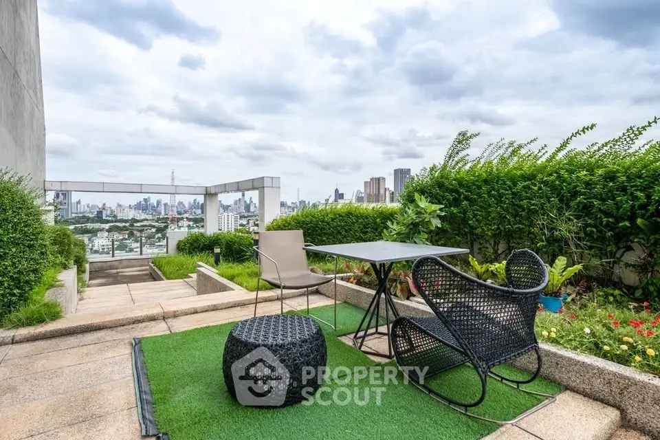 Stunning rooftop garden with city skyline view, featuring modern outdoor seating and lush greenery.