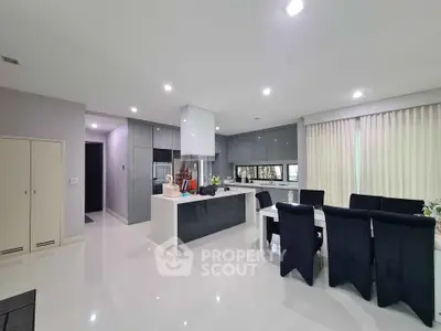 Modern kitchen with sleek design and spacious dining area in luxury home