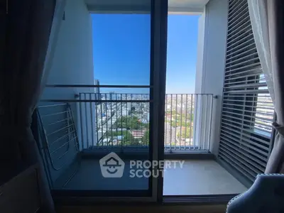 Modern apartment balcony with stunning city view and sleek design.