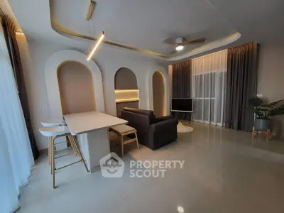 Modern living room with stylish lighting and cozy seating area