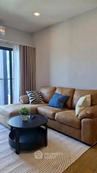 Modern living room with cozy brown sofa and stylish decor