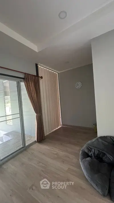 Spacious living room with sliding glass doors and modern decor