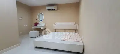Spacious bedroom with modern decor and air conditioning unit
