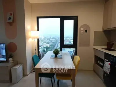 Modern dining area with city view, stylish decor, and cozy ambiance in a high-rise apartment.