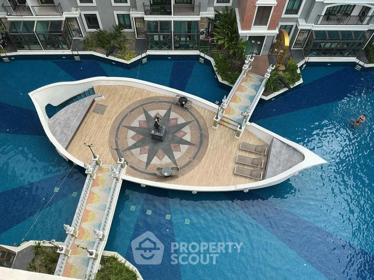Luxurious apartment complex with unique boat-shaped pool and stunning design.