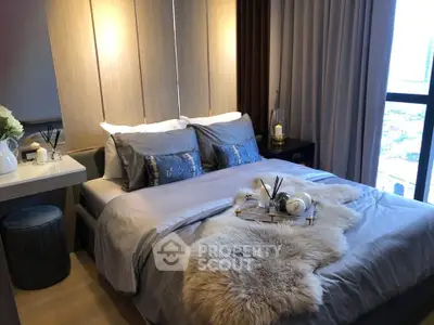 Luxurious bedroom with plush bedding and stylish decor in modern apartment