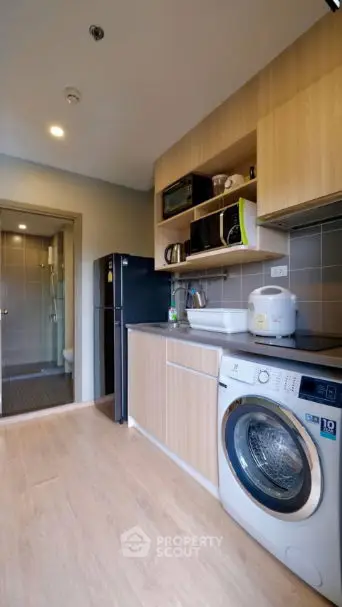 Modern kitchen with sleek appliances and open shelving