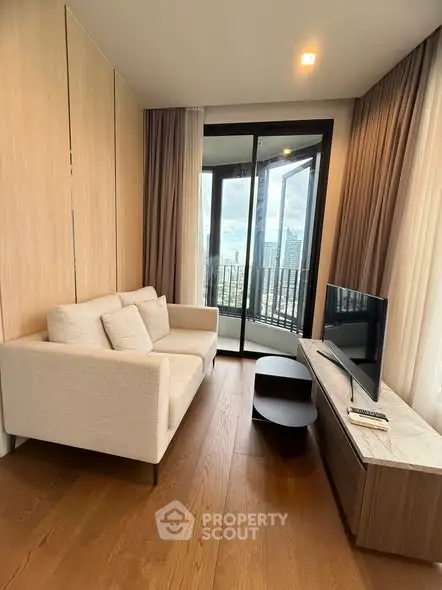 Modern living room with city view balcony and sleek furniture