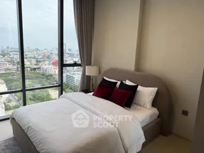 Luxurious bedroom with stunning city view and elegant decor in high-rise apartment.