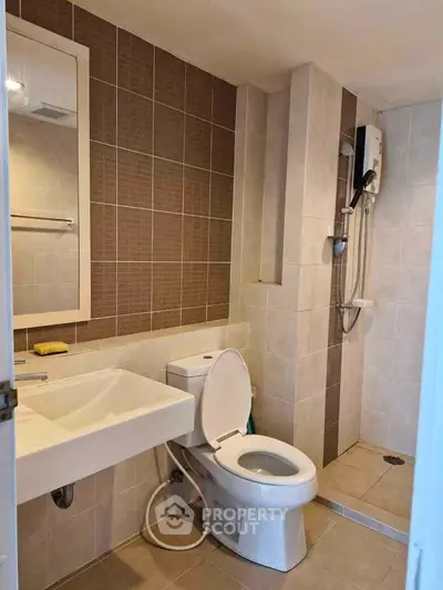 Modern bathroom with sleek fixtures and a walk-in shower in a contemporary apartment.