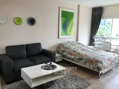 Modern studio apartment with cozy living area and stylish decor