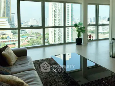 Spacious living room with stunning city view and modern decor