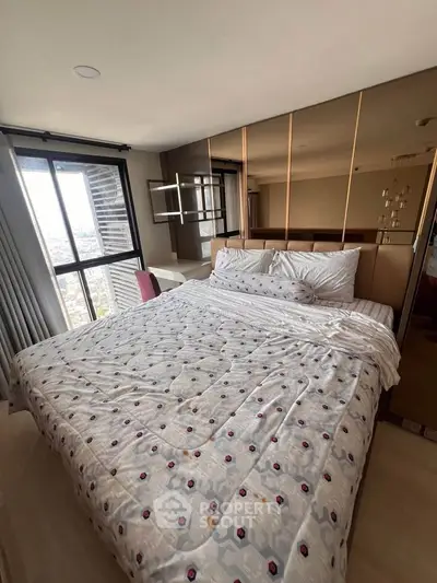 Spacious bedroom with city view and modern decor in high-rise apartment
