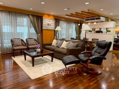 Elegant living room with modern furniture and warm lighting, featuring hardwood floors and stylish decor.