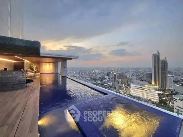 Luxurious rooftop infinity pool with stunning city skyline view at sunset.