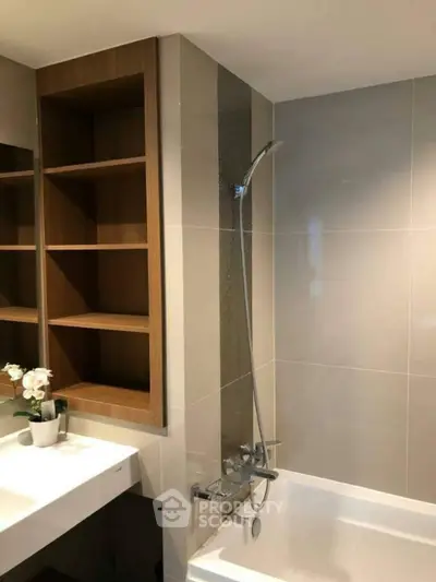 Modern bathroom with sleek design and built-in shelving