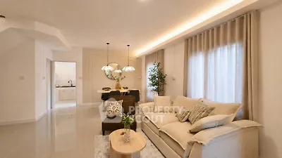 Elegant living room with cozy sofa and modern decor in a bright open layout.