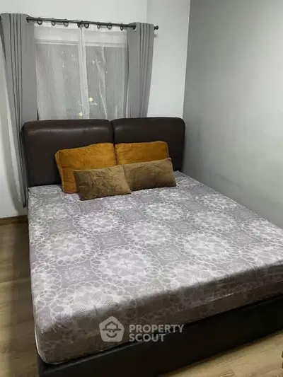 Cozy bedroom with modern decor and comfortable bed in a stylish apartment.