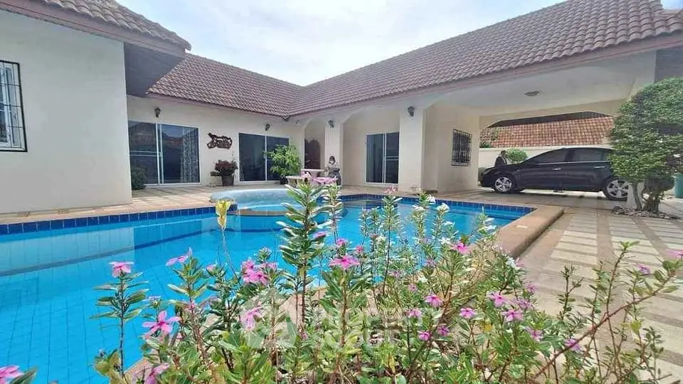 Luxurious villa with private pool and lush garden in serene neighborhood
