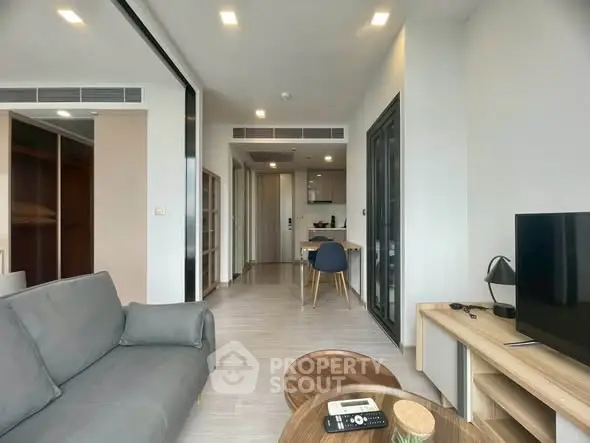 Modern living room with open layout and stylish furniture in a contemporary apartment.