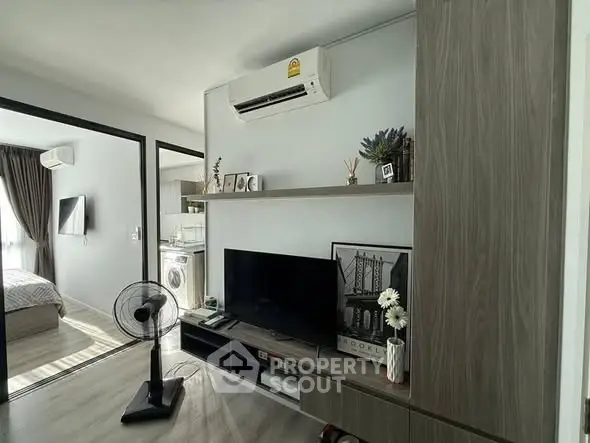 Modern living room with air conditioning and stylish decor in a contemporary apartment.