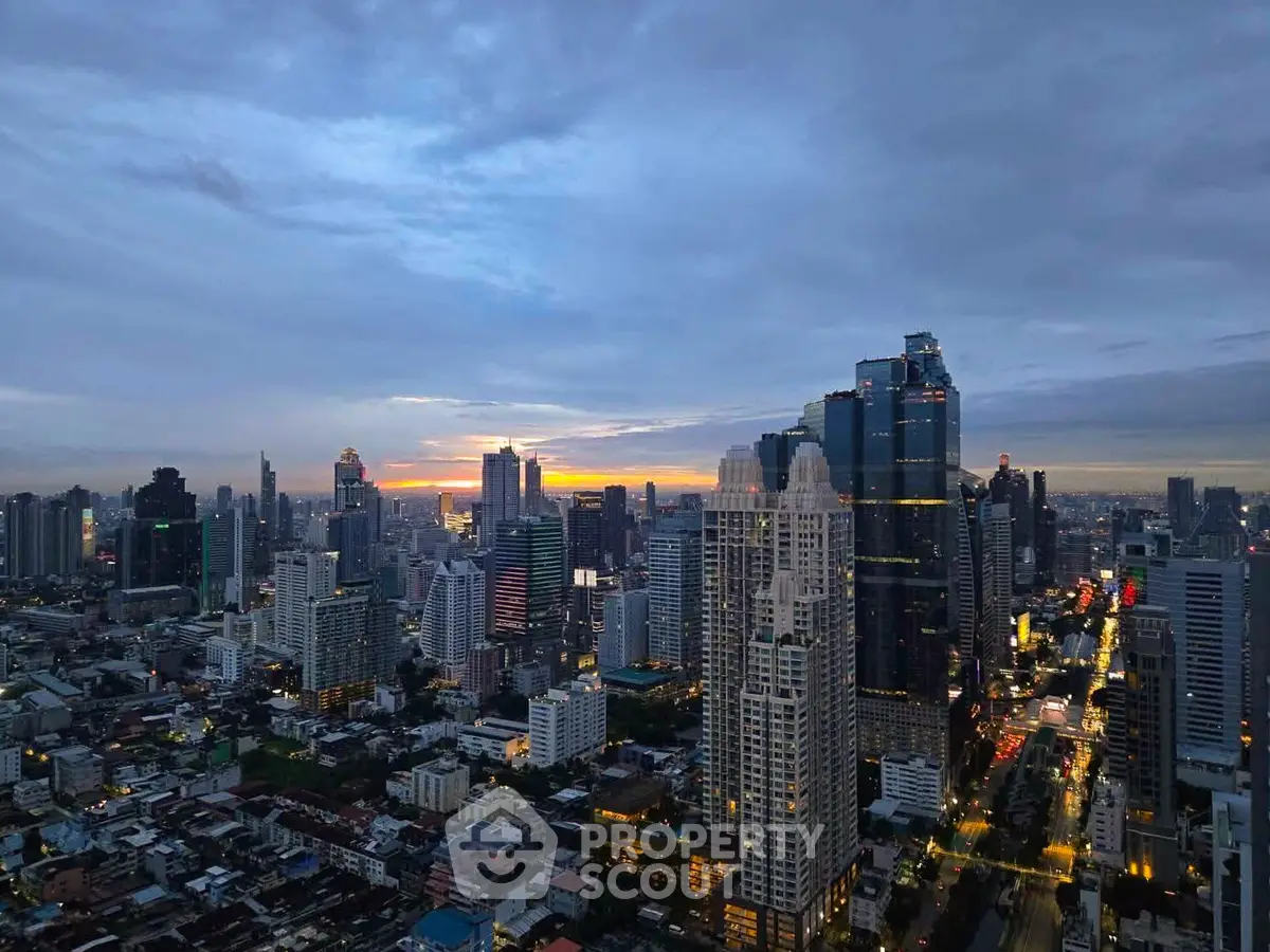 Stunning cityscape view of a vibrant urban skyline at dusk, showcasing modern skyscrapers and a beautiful sunset.