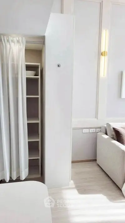 Modern living room with hidden storage and elegant lighting