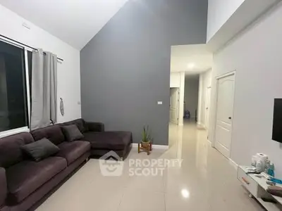 Spacious modern living room with high ceiling and elegant decor