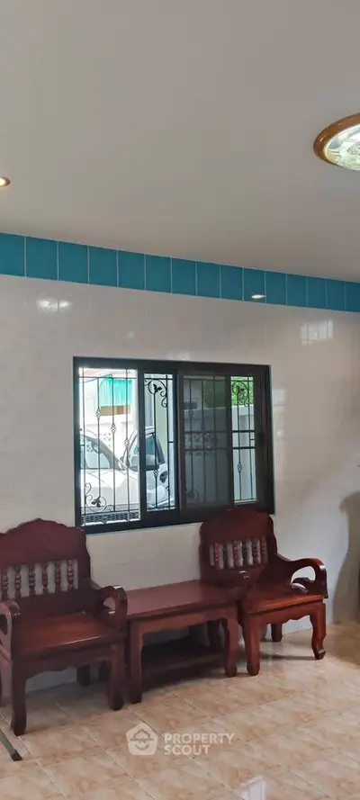 Charming interior with wooden seating and tiled walls, perfect for cozy gatherings.
