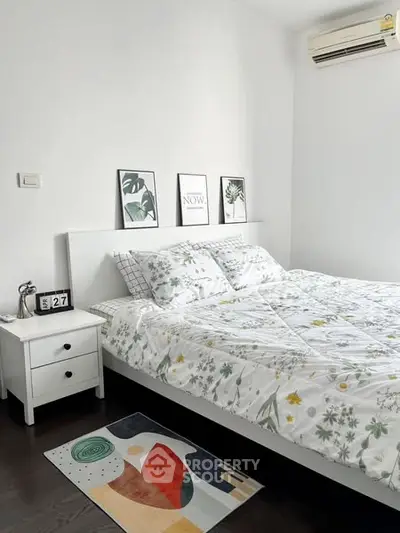 Cozy bedroom with stylish decor and modern air conditioning unit