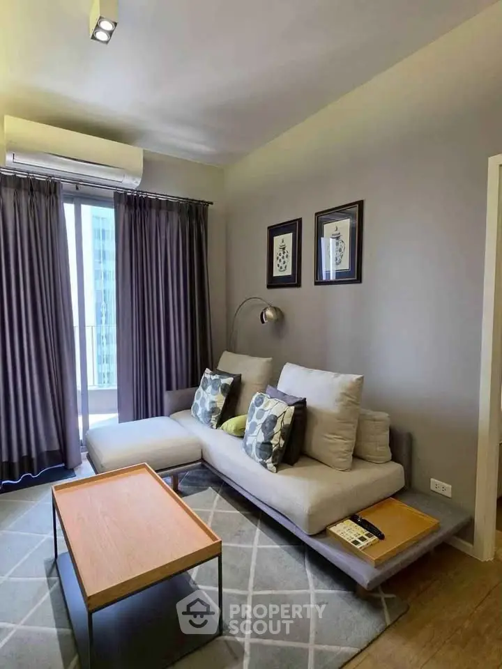 Modern living room with stylish sofa and elegant decor in a cozy apartment.
