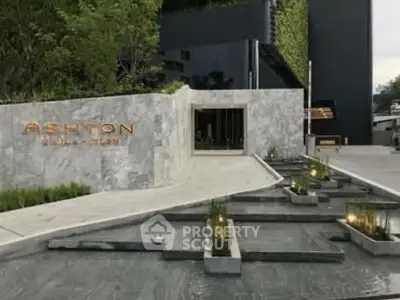 Luxurious building entrance with modern design and water feature
