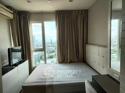 Modern bedroom with city view, featuring large windows and elegant furnishings in a high-rise apartment.