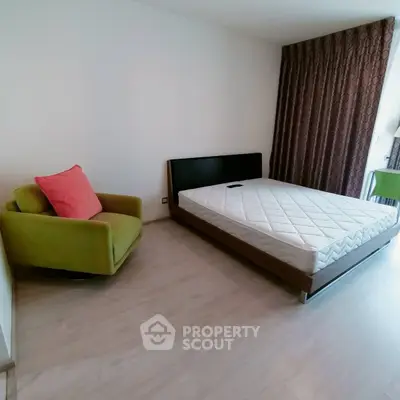 Spacious bedroom with modern furniture and natural light