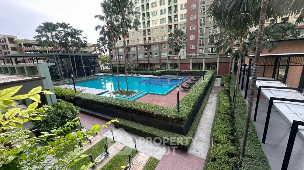 Luxurious condominium with stunning pool and lush landscaping