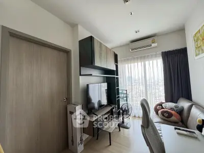 Modern living room with stylish furniture and large window offering city view