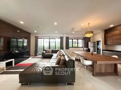 Spacious modern living room with open layout and elegant dining area