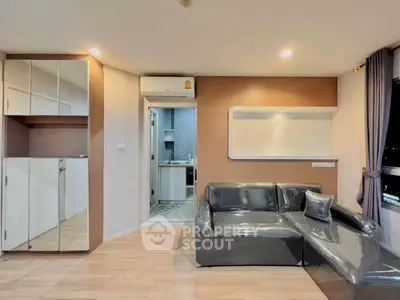 Modern living room with sleek furniture and open kitchen view