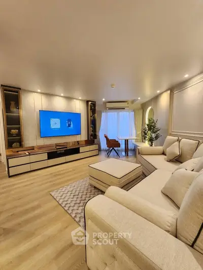 Luxurious modern living room with elegant decor and spacious seating area.
