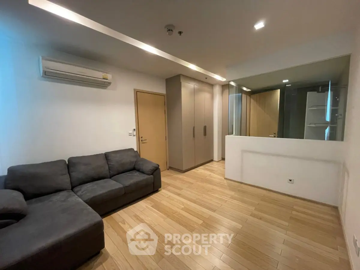 Spacious living room with modern design and wooden flooring