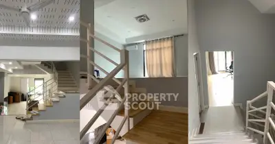 Modern multi-level interior with sleek staircase and natural light, perfect for contemporary living.