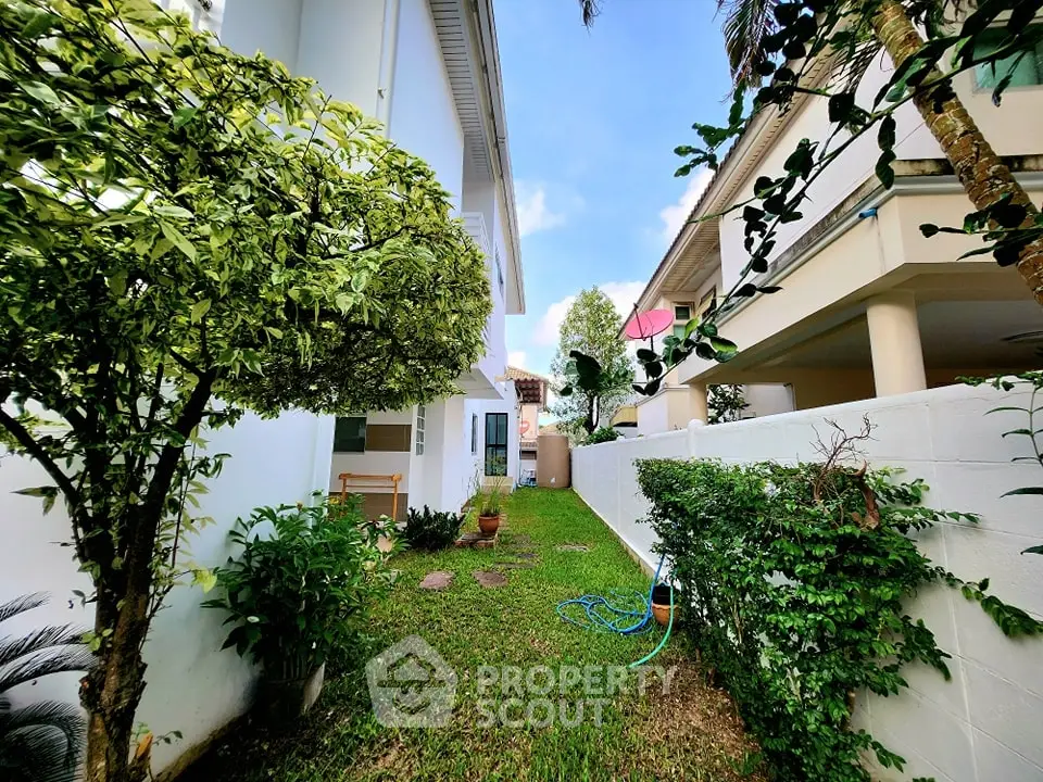 Charming garden view with lush greenery and modern exterior in suburban home