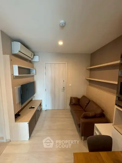 Modern living room with sleek design and cozy brown sofa